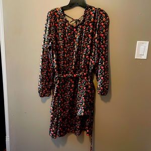 Black dress with floral print and gold threading throughout. Tiered skirt